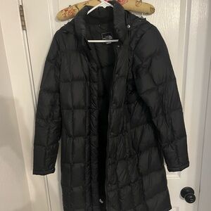 Size M black The North Face puffer 3/4 length. Super warm and cozy.